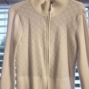 White House Black Market zip up jacket with a white  metallic pattern.